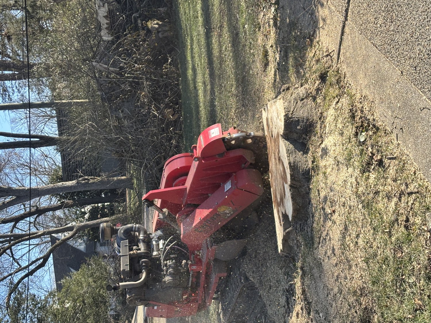 Stump grinder taking a stump below grade